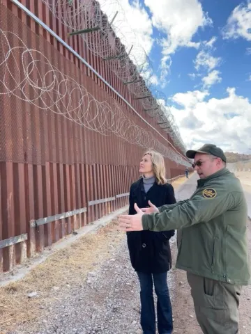 Photo on the right: Rep. Ciscomani highlights how the border wall on the right is the first wall, constructed by Mexico, and the border wall on the left is the second wall    constructed by the Obama administration. 